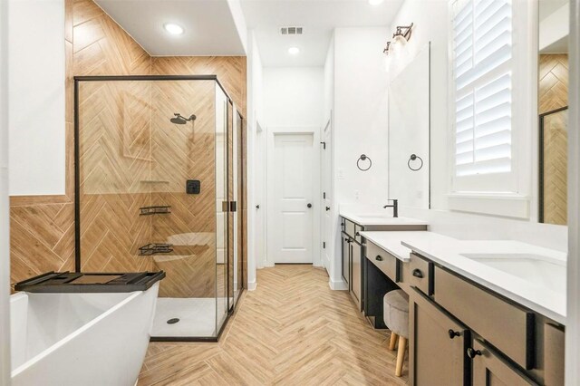 7828 Pace Ravine Dr, Lago Vista, TX 78645 - bathroom featuring plus walk in shower, parquet floors, and vanity