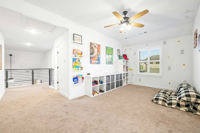 game room featuring lofted ceiling, ceiling fan, and carpet flooring