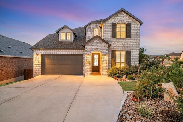 french country home with a garage