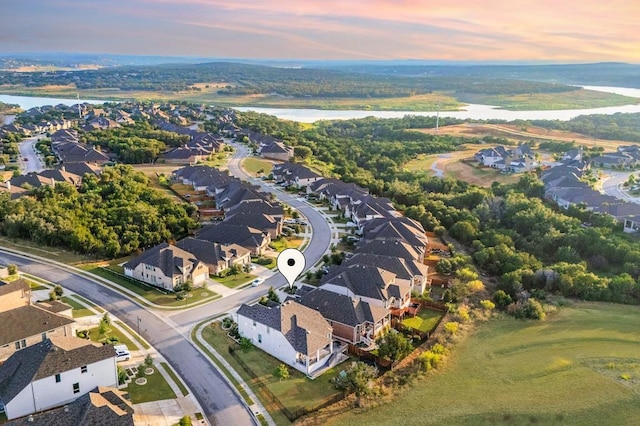 7828 Pace Ravine Dr, Lago Vista, TX 78645 - aerial view at dusk featuring a water view