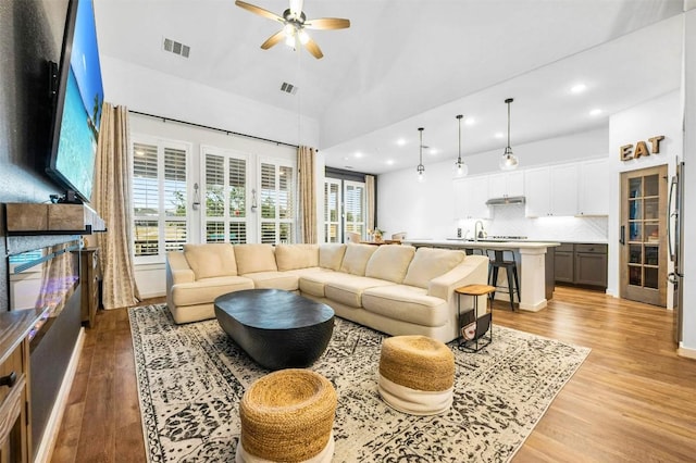 7828 Pace Ravine Dr, Lago Vista, TX 78645 - living room featuring high vaulted ceiling, ceiling fan, and light wood-type flooring