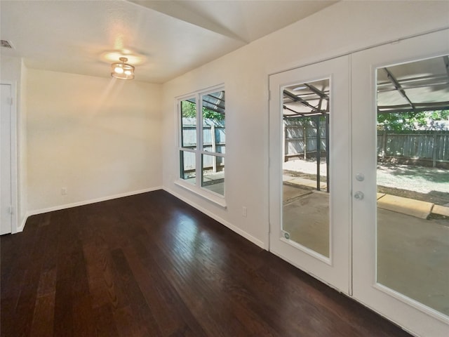 interior space with dark hardwood / wood-style flooring and french doors