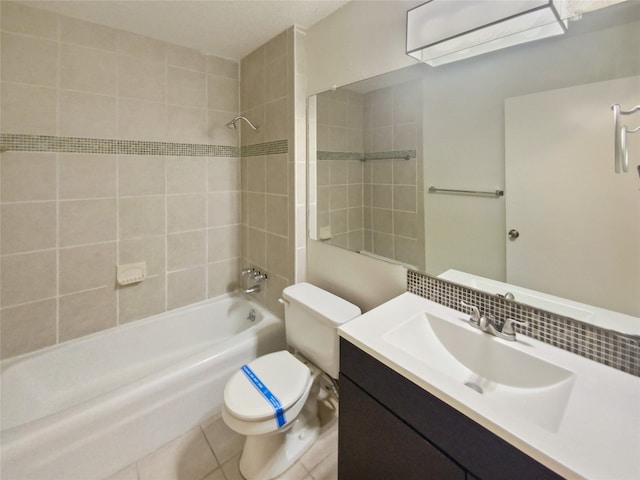 full bathroom featuring vanity, tasteful backsplash, tile patterned flooring, toilet, and tiled shower / bath