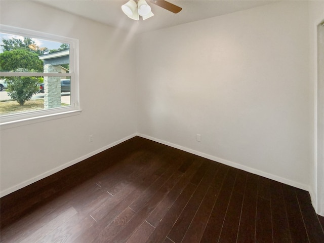 unfurnished room featuring ceiling fan and dark hardwood / wood-style floors