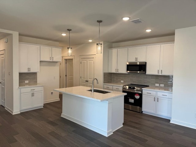 kitchen with white cabinetry, stainless steel appliances, and sink