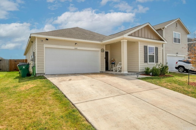 ranch-style house featuring a garage and a front yard