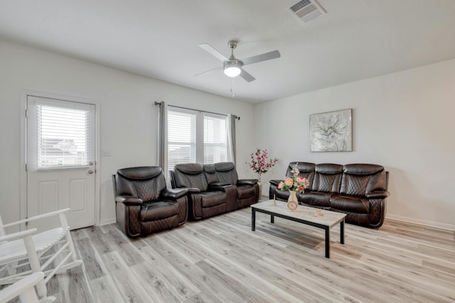 14601 Shooter Mc Gavin Dr, Manor, TX 78653 - living area with light wood finished floors and a ceiling fan
