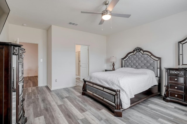 bedroom with light wood-type flooring and ceiling fan