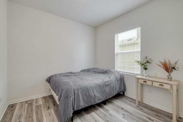 bedroom featuring light wood-type flooring