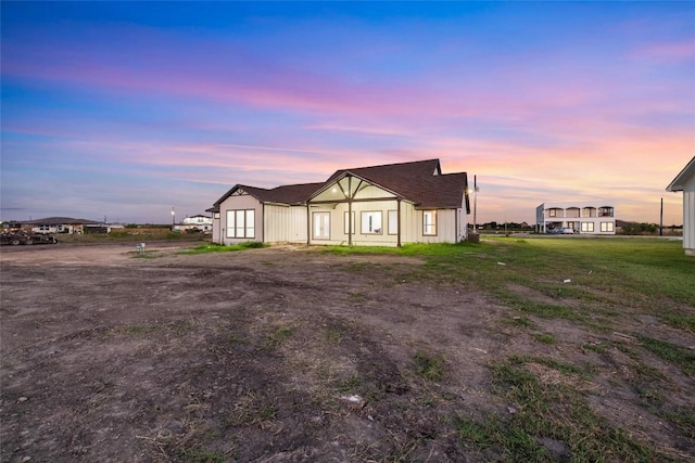 view of back of property at dusk