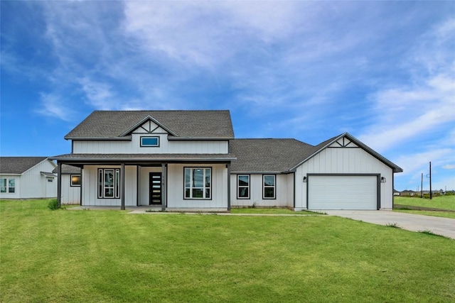 modern farmhouse with a front lawn, driveway, a shingled roof, covered porch, and a garage