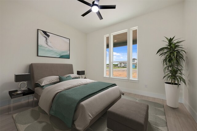 bedroom featuring ceiling fan and light hardwood / wood-style floors