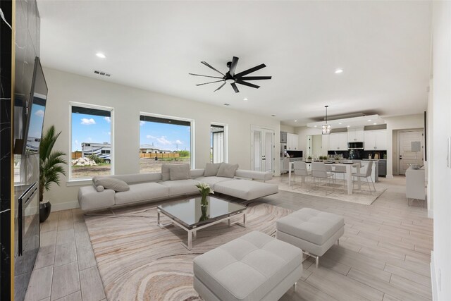 living room featuring ceiling fan