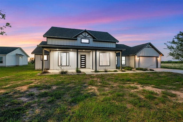 116 Bianca Cir, Del Valle, TX 78617 - modern inspired farmhouse with an attached garage, concrete driveway, a front lawn, and roof with shingles