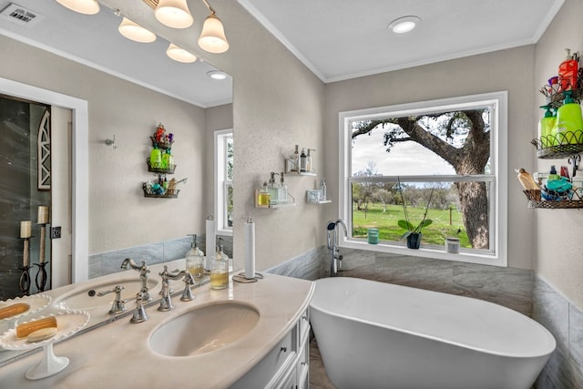 1619 Althaus Ranch Rd, Johnson City, TX 78636 - bathroom with a freestanding tub, vanity, tile walls, and crown molding