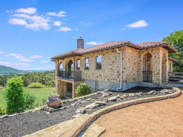 rear view of property featuring a yard