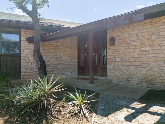 doorway to property featuring a porch