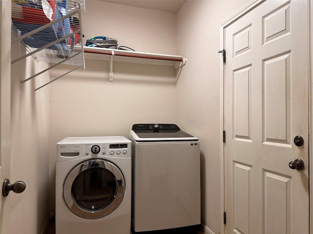 clothes washing area featuring washing machine and dryer