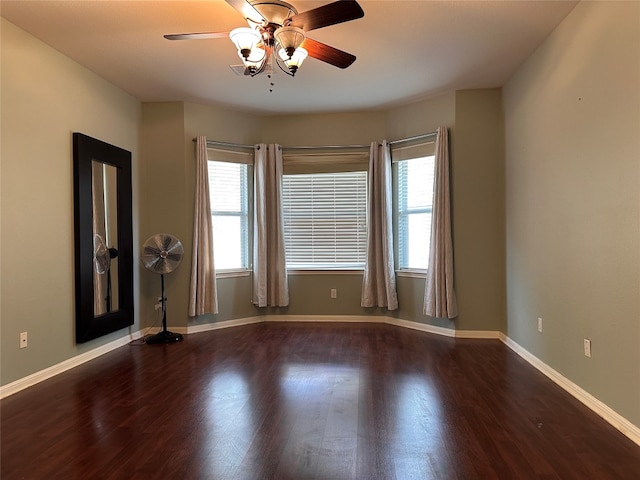 unfurnished room featuring ceiling fan, plenty of natural light, and wood-type flooring