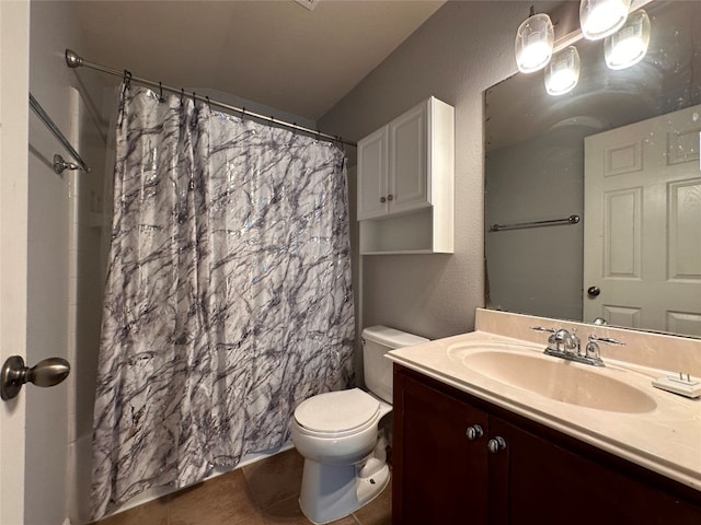 bathroom featuring toilet, vanity, tile patterned floors, and a shower with shower curtain