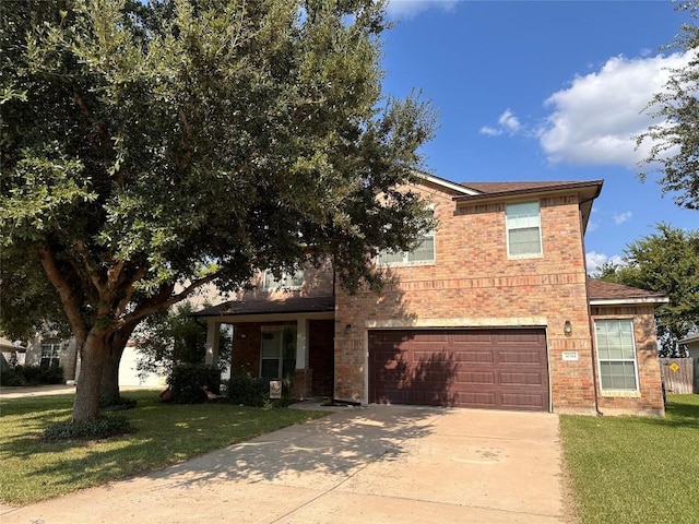 view of front of property featuring a garage and a front yard