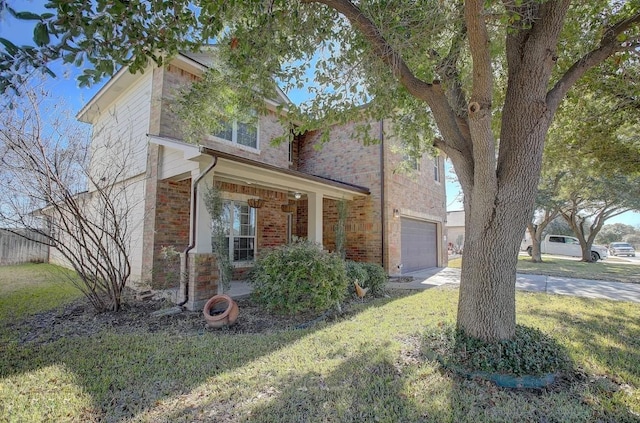 view of front of house with a garage, a porch, and a front lawn