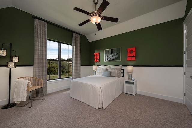 bedroom featuring ceiling fan, lofted ceiling, and light colored carpet