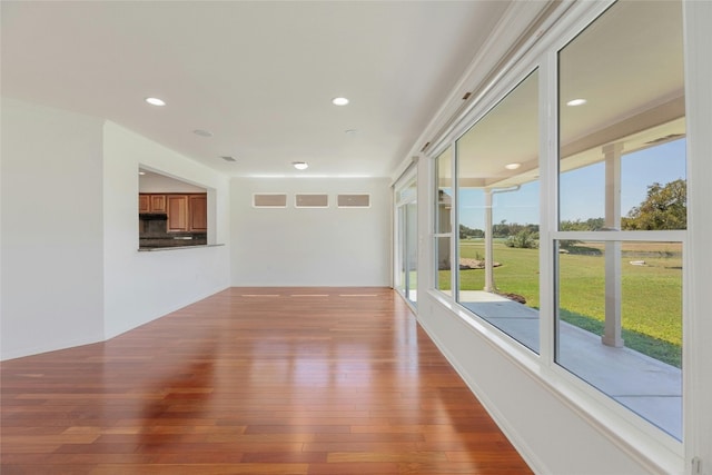 unfurnished room featuring hardwood / wood-style flooring