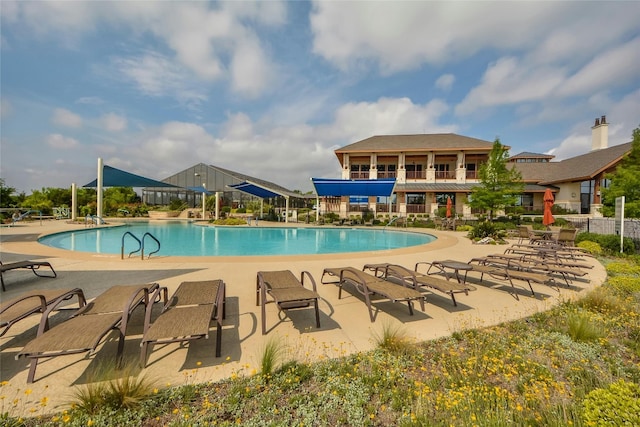 view of swimming pool with a patio