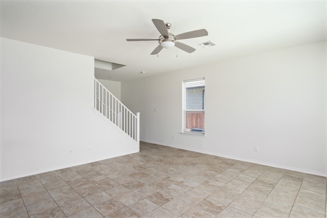 unfurnished room with ceiling fan