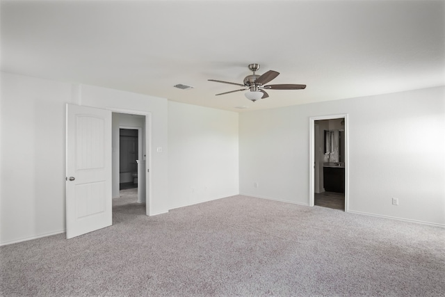 carpeted empty room with ceiling fan