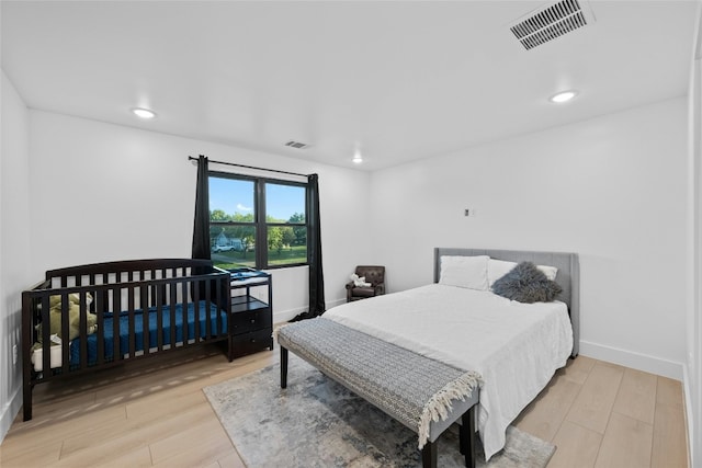 bedroom with light hardwood / wood-style floors