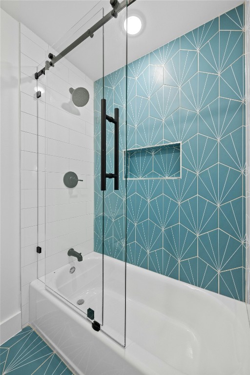 bathroom featuring combined bath / shower with glass door and tile patterned floors