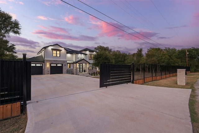 gate at dusk with a garage