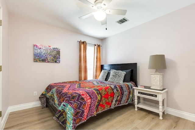 bedroom with light wood-type flooring and ceiling fan