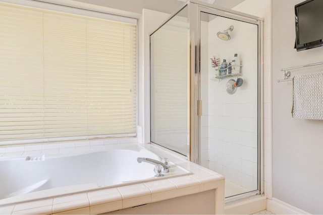 bathroom with independent shower and bath