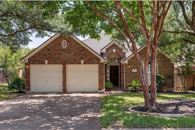 view of front of property with a garage and a front lawn