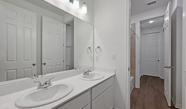 bathroom featuring vanity and hardwood / wood-style flooring