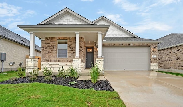 view of front of property with a front lawn and a garage