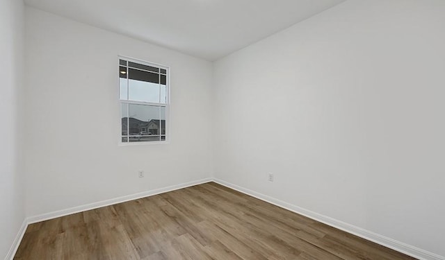 unfurnished room with light hardwood / wood-style floors