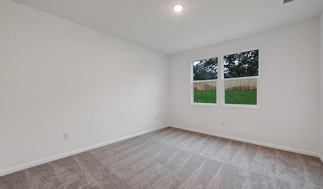 unfurnished room with carpet flooring