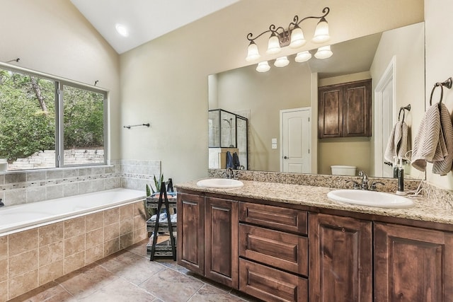 full bathroom featuring vanity, toilet, independent shower and bath, and vaulted ceiling