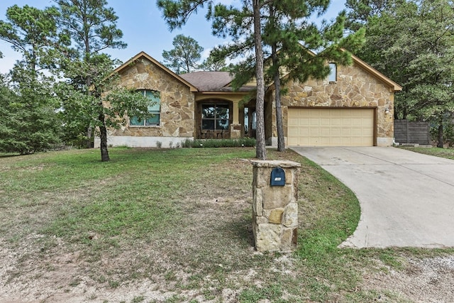 ranch-style home with a garage and a front lawn