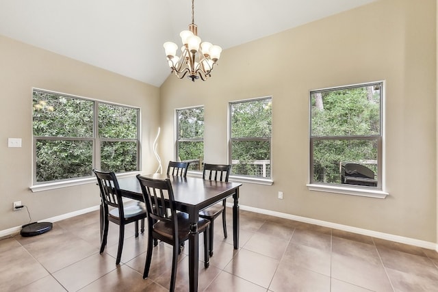 tiled dining room featuring vaulted ceiling and an inviting chandelier