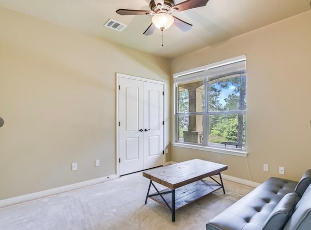 living area with ceiling fan