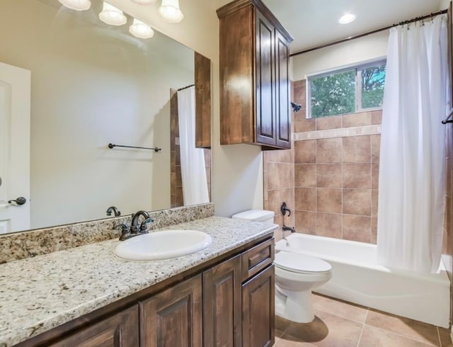 full bathroom with tile patterned flooring, vanity, toilet, and shower / tub combo