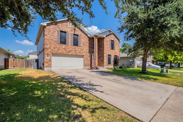 view of front of house featuring a garage, a front lawn, and central air condition unit