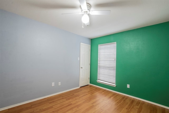 unfurnished room with light hardwood / wood-style flooring and ceiling fan