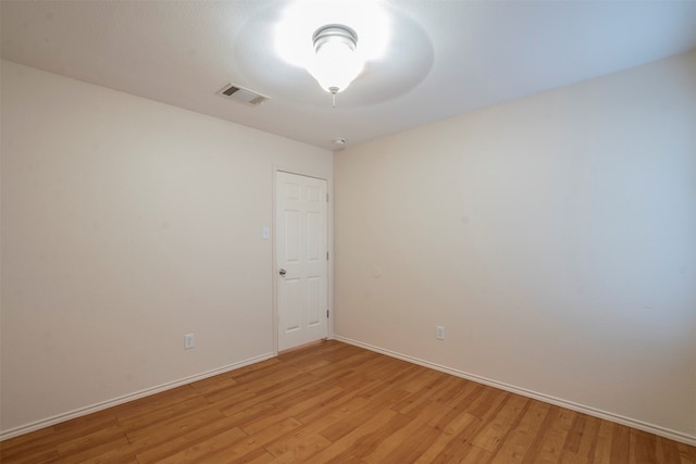 empty room with light hardwood / wood-style floors