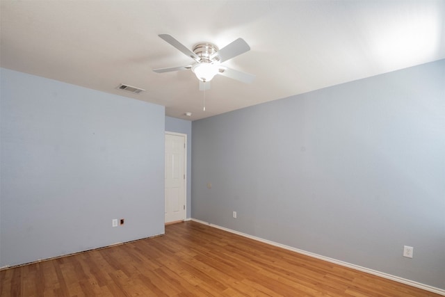 empty room with light hardwood / wood-style flooring and ceiling fan